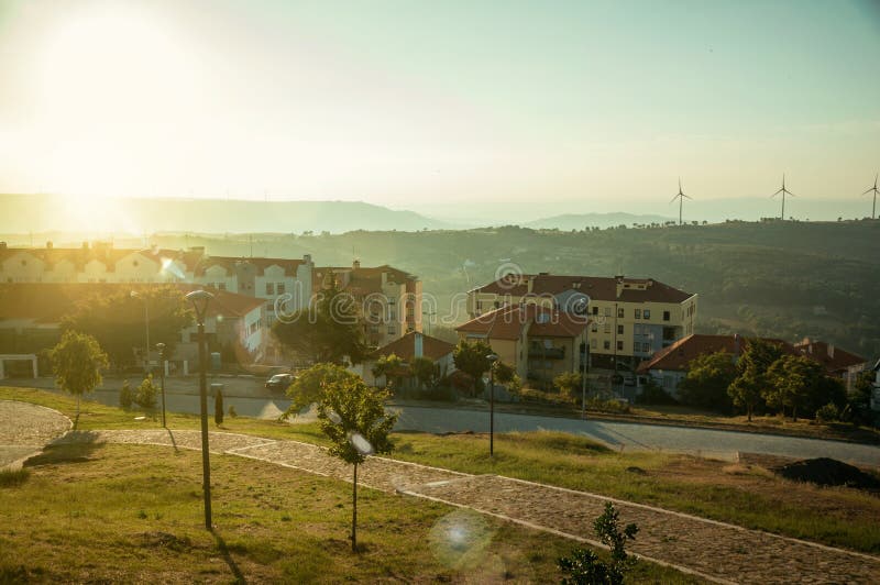 Modern apartment buildings in front of garden on sunset stock images Modern apartment buildings in front of garden on sunset stock images