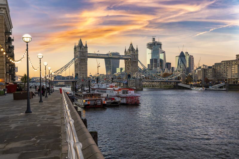 The urban skyline of London: view to the Tower Bridge and City of London during sunset, United Kingdom. The urban skyline of London: view to the Tower Bridge and City of London during sunset, United Kingdom