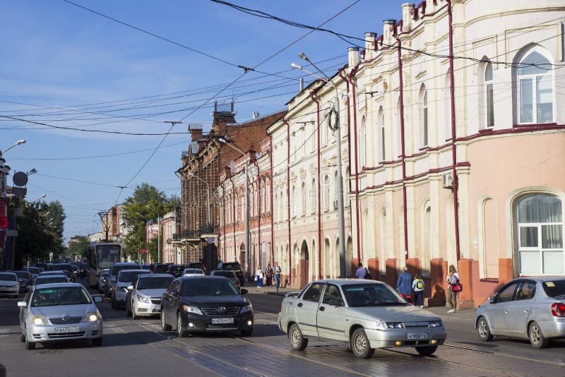 Urban transport on the road a small street of a provincial Russian city. Rosa Luxemburg street in the Siberian city of Tomsk stock images Urban transport on the road a small street of a provincial Russian city. Rosa Luxemburg street in the Siberian city of Tomsk stock images