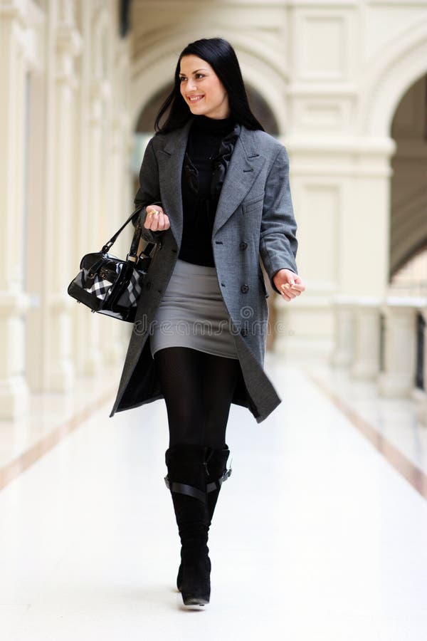 Model Wears a Black Dress, a Striking Black Gucci Belt, a White Gucci  Handbag and a Green Hair Clip Editorial Image - Image of milan, black:  161573770