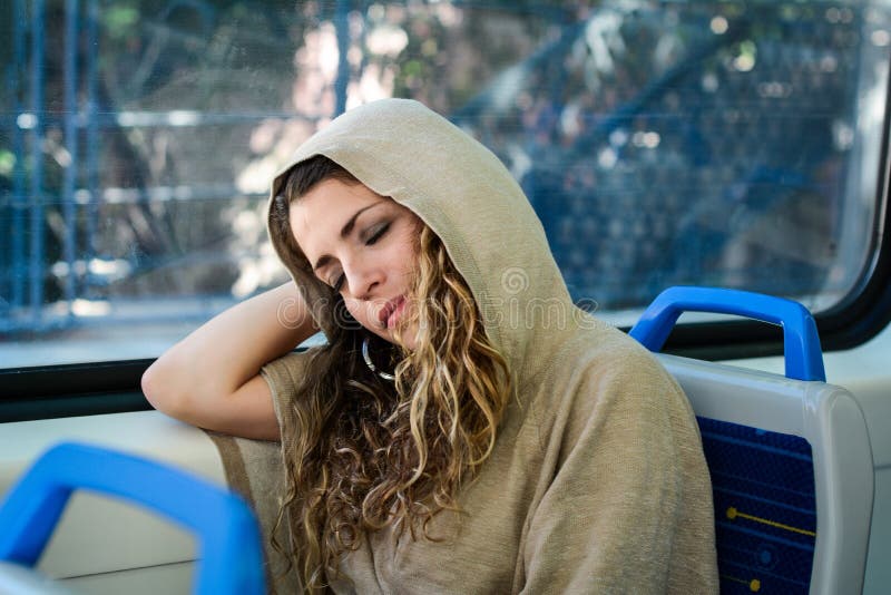 Urban woman sleeping in a train travel beside the window royalty free stock photo Urban woman sleeping in a train travel beside the window royalty free stock photo