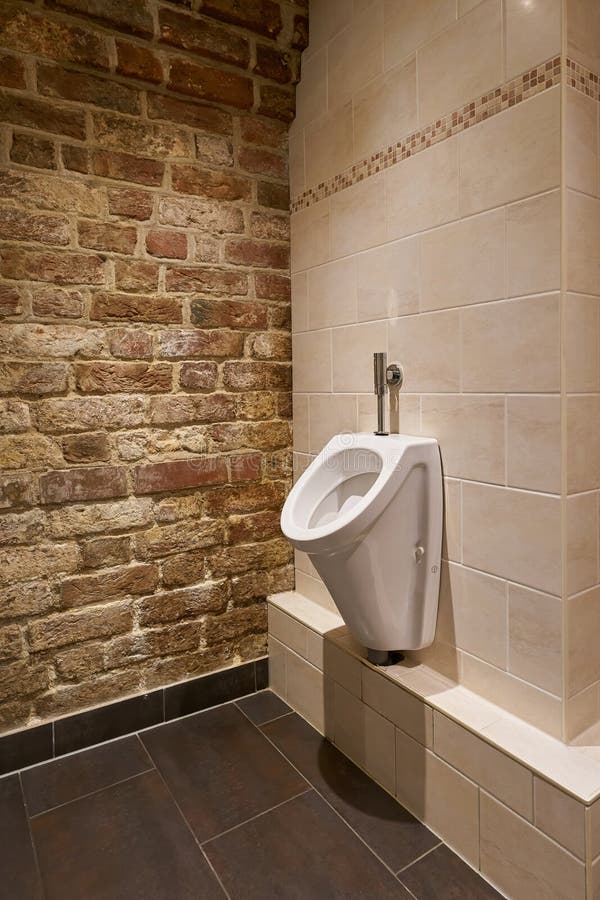 Urinal in a public toilet stock image. Image of urinating 299868989