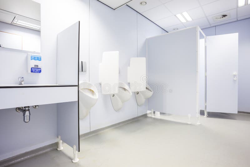 Urinal and toilet doors stock image. Image of room, indoor 74876963