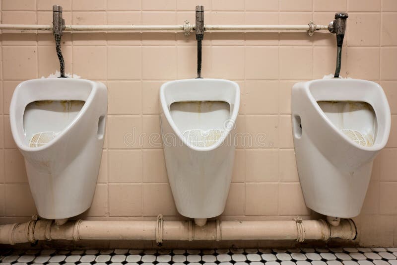 Three dirty urinals stock image. Image of male, indoors 34541143
