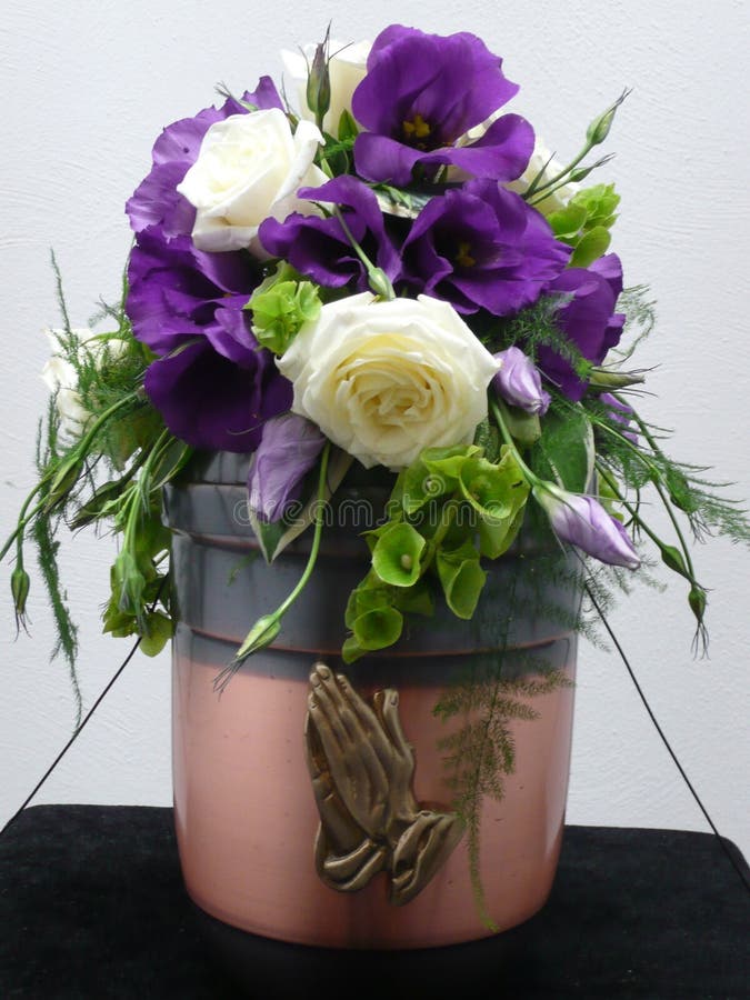 Urn decorated with flowers stock photo. Image of peace 4359872