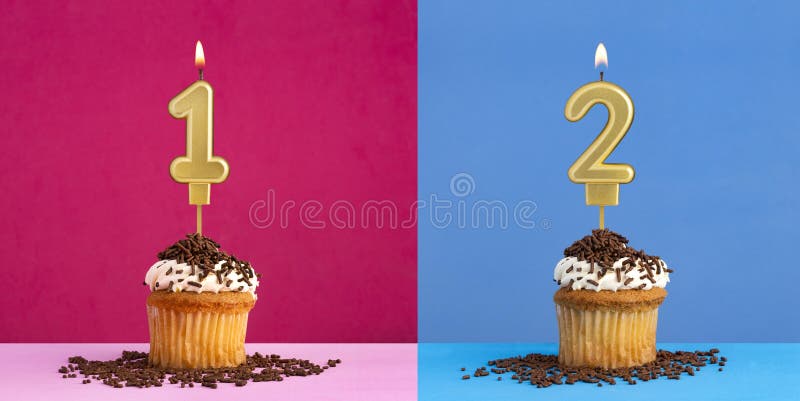 Two birthday cupcakes with the number 1 and 2 - Blue and pink background. Two birthday cupcakes with the number 1 and 2 - Blue and pink background