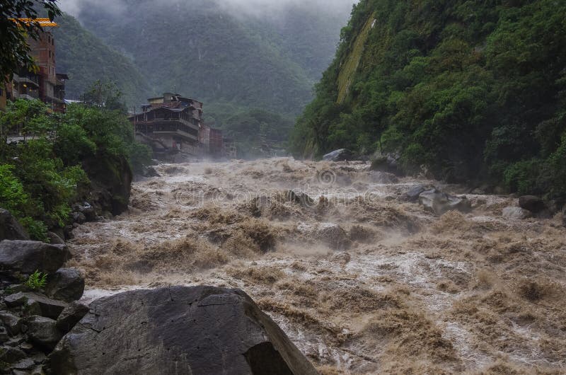 Rapids of Urubamba river near Aguas Calientes village after tropical rain, Peru. Rapids of Urubamba river near Aguas Calientes village after tropical rain, Peru