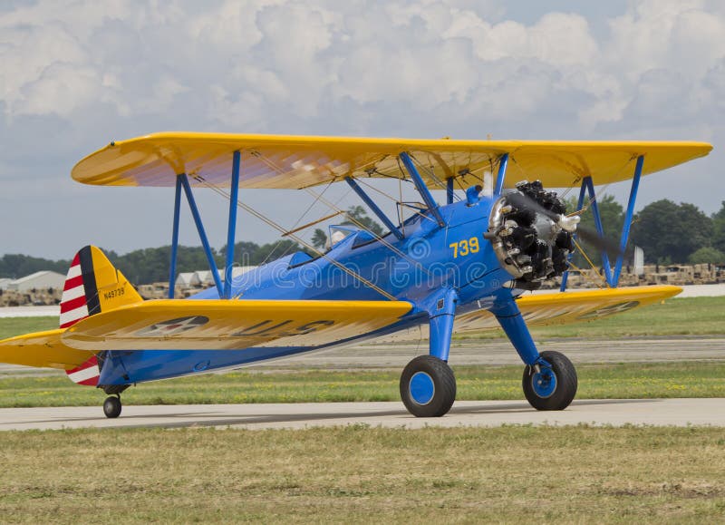 US Army Bi Plane Fighter on runway stock photo