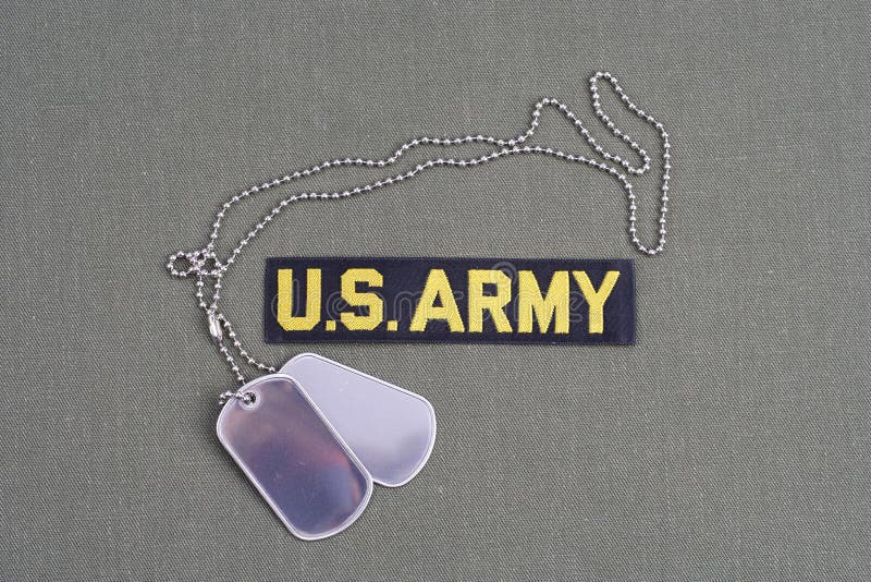US ARMY Branch of Service Tape with Dog Tags on Olive Green Uniform