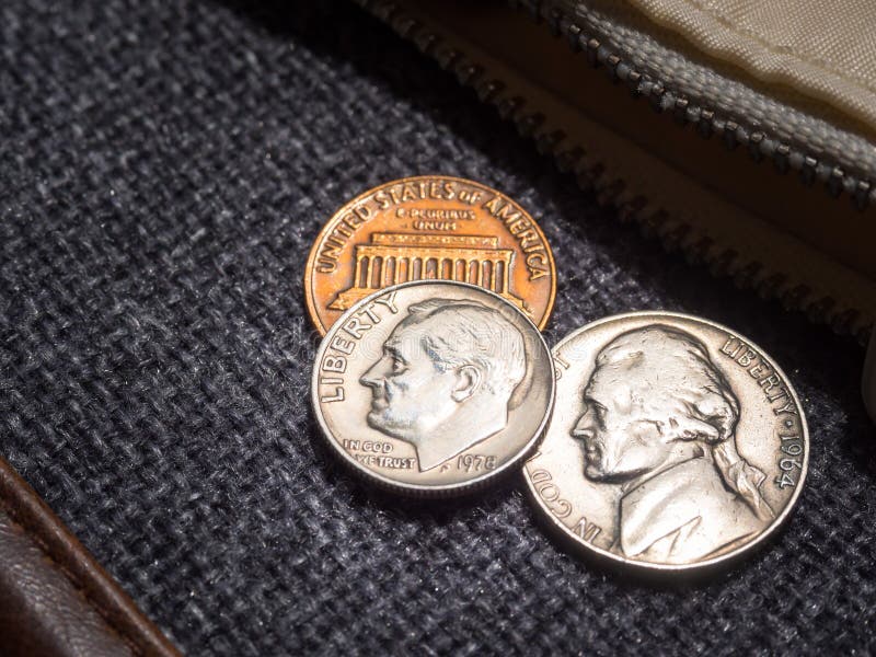 US dollar coins placed outside the wallet stock image US dollar coins placed outside the wallet stock image