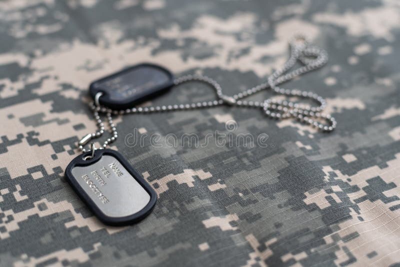 US Military Concept on Olive Green Uniform Background Stock Photo