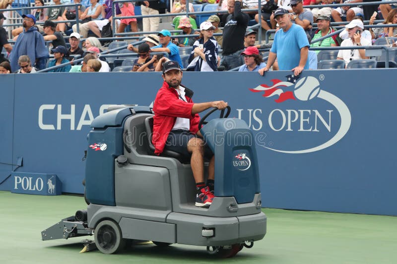 US Open cleaning crew drying tennis court after rain delay at Louis Armstrong Stadium at Billie Jean King National Tennis Center stock image US Open cleaning crew drying tennis court after rain delay at Louis Armstrong Stadium at Billie Jean King National Tennis Center stock image