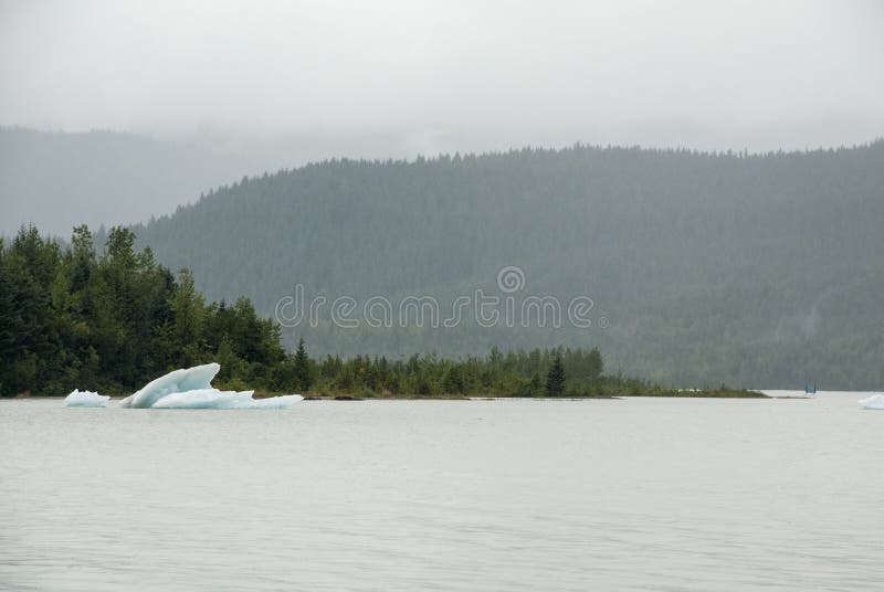USA Alaska - Mendenhall Glacier and Lake. Mendenhall Glacier in a misty day - USA Alaska, Tongass National Forest, Mendenhall Glacier Recreation Area, Travel stock image USA Alaska - Mendenhall Glacier and Lake. Mendenhall Glacier in a misty day - USA Alaska, Tongass National Forest, Mendenhall Glacier Recreation Area, Travel stock image