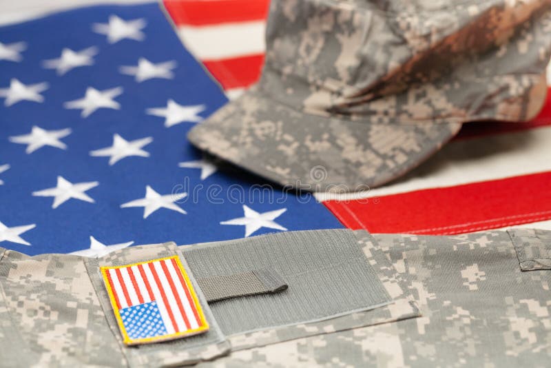 USA flag with US military uniform over it - studio shot. US flag with US military uniform over it - studio shot stock photo USA flag with US military uniform over it - studio shot. US flag with US military uniform over it - studio shot stock photo