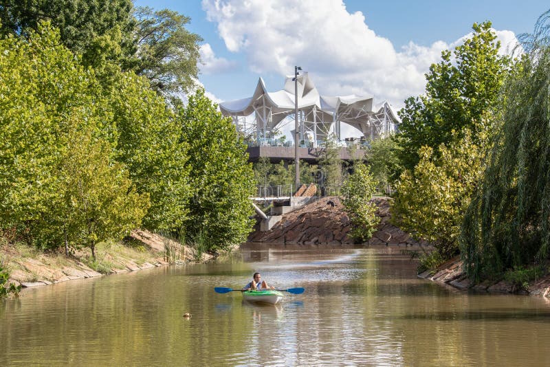 USA The Gathering Place - Award Winning Free Public Theme Park in Oklahoma - Man chills in kayak as he floats the