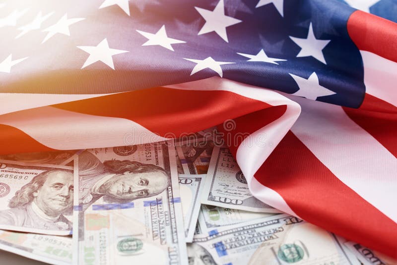 USA national flag and the currency usd money banknotes. Business and finance concept