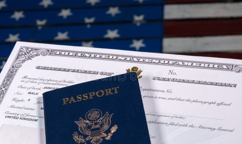 USA passport and naturalization certificate over US Flag royalty free stock image