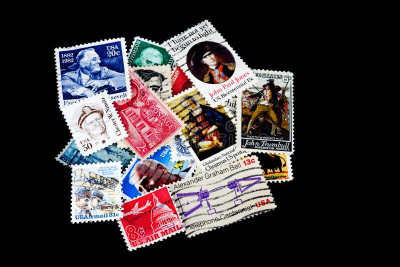 USA Postage Stamp Collection on Black Background stock photo USA Postage Stamp Collection on Black Background stock photo