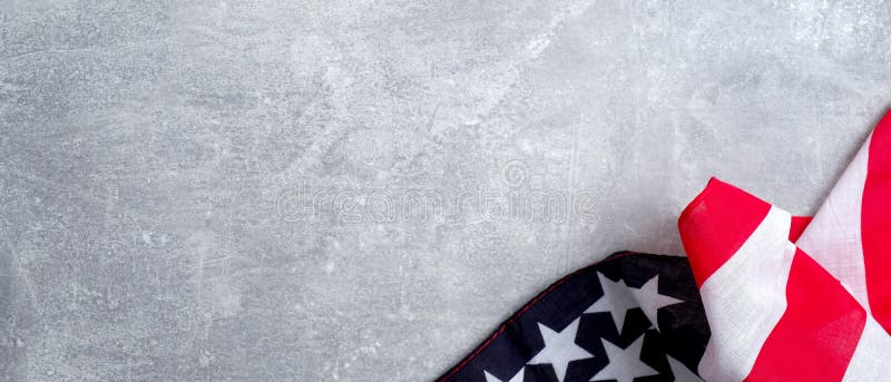 USA American flag on stone table. Banner mockup for US Memorial day, Presidents day, Veterans day, Labor day, or 4th of July celebration. With blank space for text. USA American flag on stone table. Banner mockup for US Memorial day, Presidents day, Veterans day, Labor day, or 4th of July celebration. With blank space for text