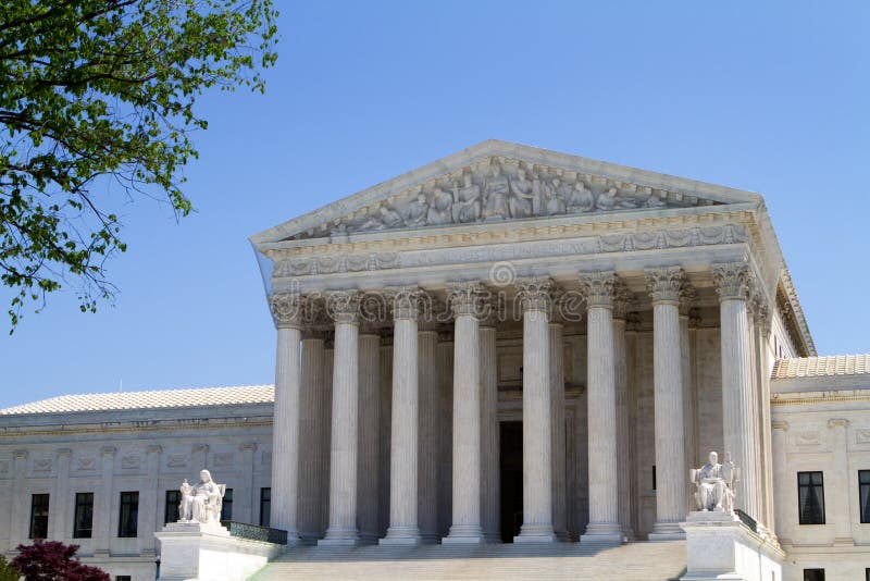 USA Supreme Court building in Washington, D.C. against a blue sky background.