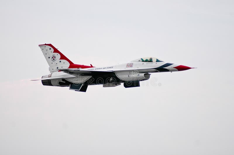 Member of the USAF Thunderbirds flies through the air during performance.