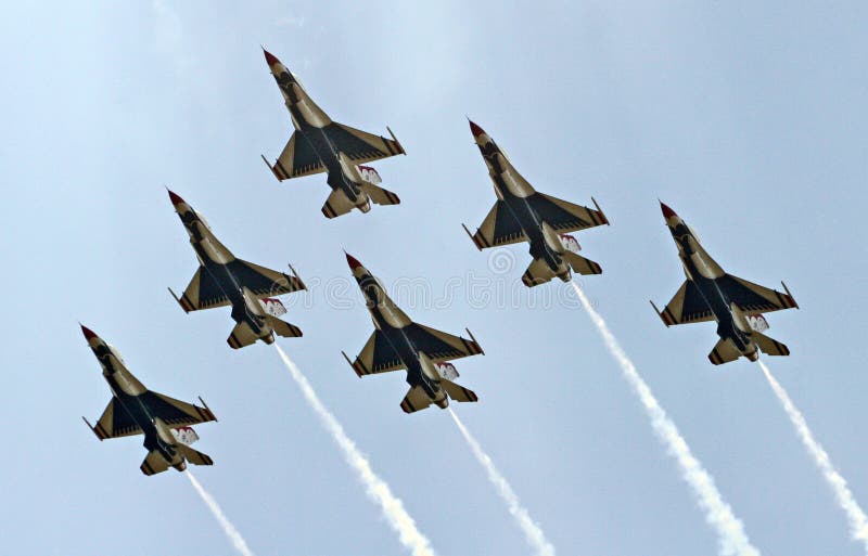 Six airforce thunderbirds in a delta formation. Six airforce thunderbirds in a delta formation