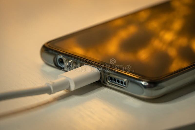 USB Cable with Smartphone on Nightstand at Night Stock Image Image of
