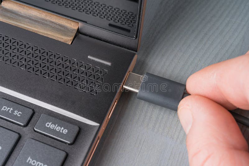 USB Type C Grey Cable Being Connected To the Laptop Stock Photo Image