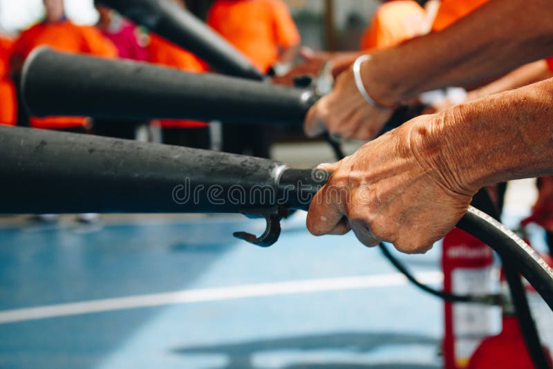 Use a fire extinguisher to fire at the gas tank. Cooking, fireman. People preparedness for fire drill and training to use a fire safety tank in village royalty free stock images Use a fire extinguisher to fire at the gas tank. Cooking, fireman. People preparedness for fire drill and training to use a fire safety tank in village royalty free stock images