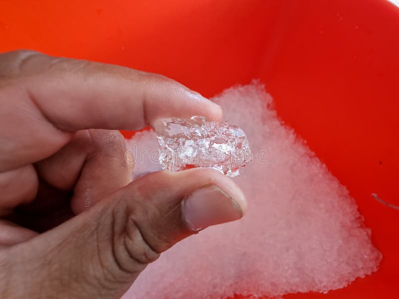 Use Your Hands To Lift Large Ice Cubes. Stock Photo, Picture and Royalty  Free Image. Image 77489653.