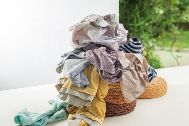 Used Clothes in a Pile on a Laundry Basket. Stock Photo - Image of ...