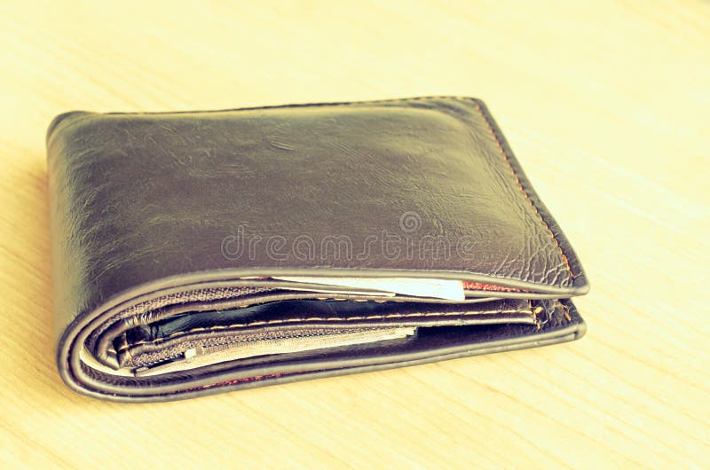 Used Leather Wallet With Money On Wood Background Stock Photo - Image of dollar, purse: 62961334