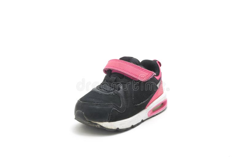 Used pink - black shoe for kids isolated on white background royalty free stock images Used pink - black shoe for kids isolated on white background royalty free stock images