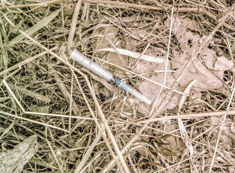 A Used Syringe Was Lying on the Ground. Stock Image Image of