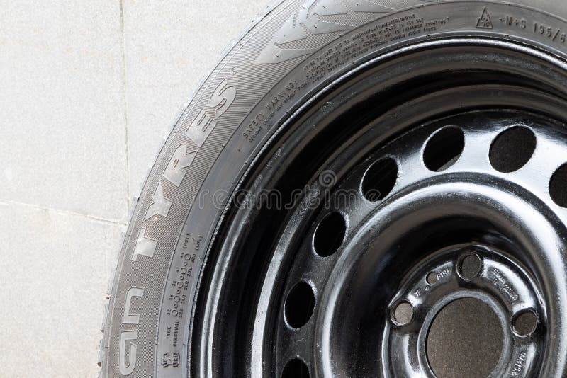 Used Winter Studded Tire for Car.Studded Wheel for Car Closeup Stock