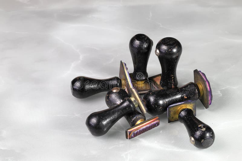 Used Wooden Rubber Stamps Isolated on Reflection Surface Stock Photo