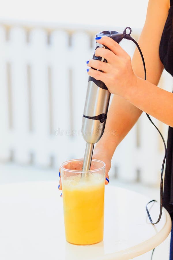 Using Blender for Making a Healthy Fresh Orange Juice Stock Image