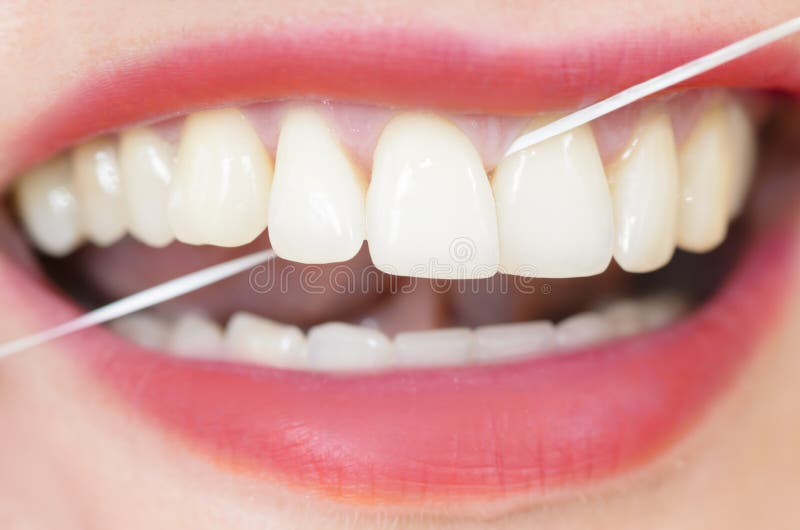 Using Dental Floss royalty free stock photography Using Dental Floss royalty free stock photography