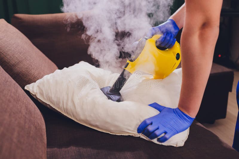 Using Dry Steam Cleaner To Sanitize Pillow. Stock Photo Image of