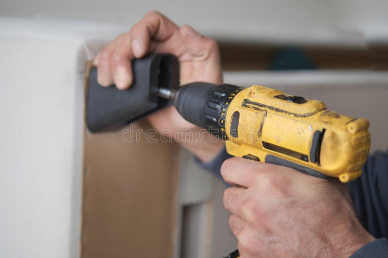 Using Electric Drilling on Fixing Sofa Stock Photo Image of repair