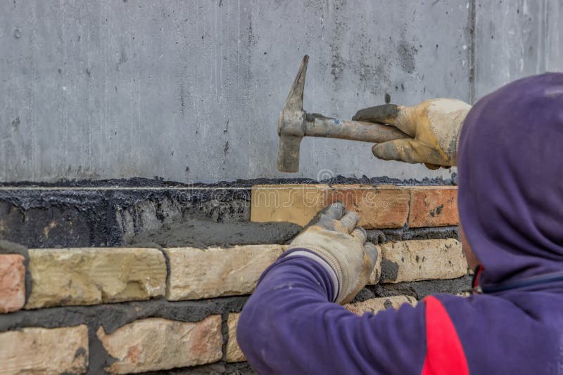 Brick Mason Using Trowel To Spread a Mortar 2 Stock Photo Image of