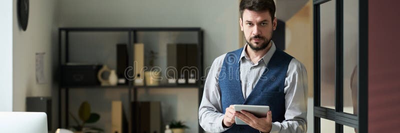 Using tablet and looking at camera stock photos