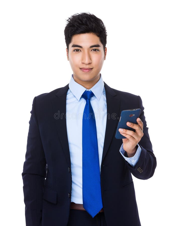 Uso asiático do homem de negócios do telefone celular imagens de stock Uso asiático do homem de negócios do telefone celular imagens de stock
