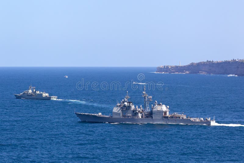 Sydney, Australia - October 11, 2013: USS Chosin CG-65 Ticonderoga-class guided-missile cruiser and Royal Australian Navy Anzac-class frigate HMAS Parramatta sailing at sea