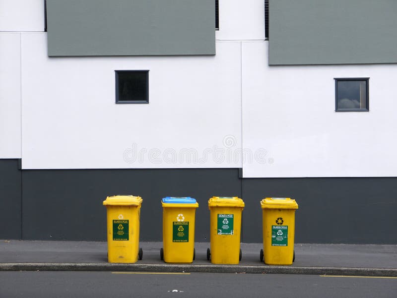Utilities: yellow recycling bins royalty free stock image