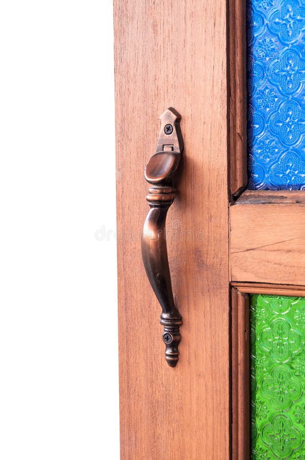 Utilizado para abrir la captura de la puerta, tiradores de puerta colorea el vidrio del vintage, parte de la puerta de madera foto de archivo libre de regalías Utilizado para abrir la captura de la puerta, tiradores de puerta colorea el vidrio del vintage, parte de la puerta de madera foto de archivo libre de regalías
