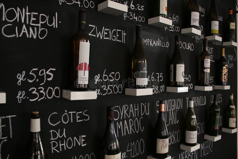 Utrecht, Netherlands - March 10, 2019: Wall with winebottles that are being sold in a wine bar stock photography Utrecht, Netherlands - March 10, 2019: Wall with winebottles that are being sold in a wine bar stock photography