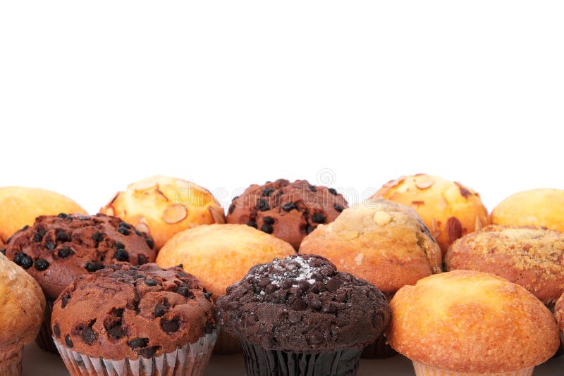 Utrymme för kopia för bakgrund för gräns för muffinkoppkakor vitt arkivbilder Utrymme för kopia för bakgrund för gräns för muffinkoppkakor vitt arkivbilder