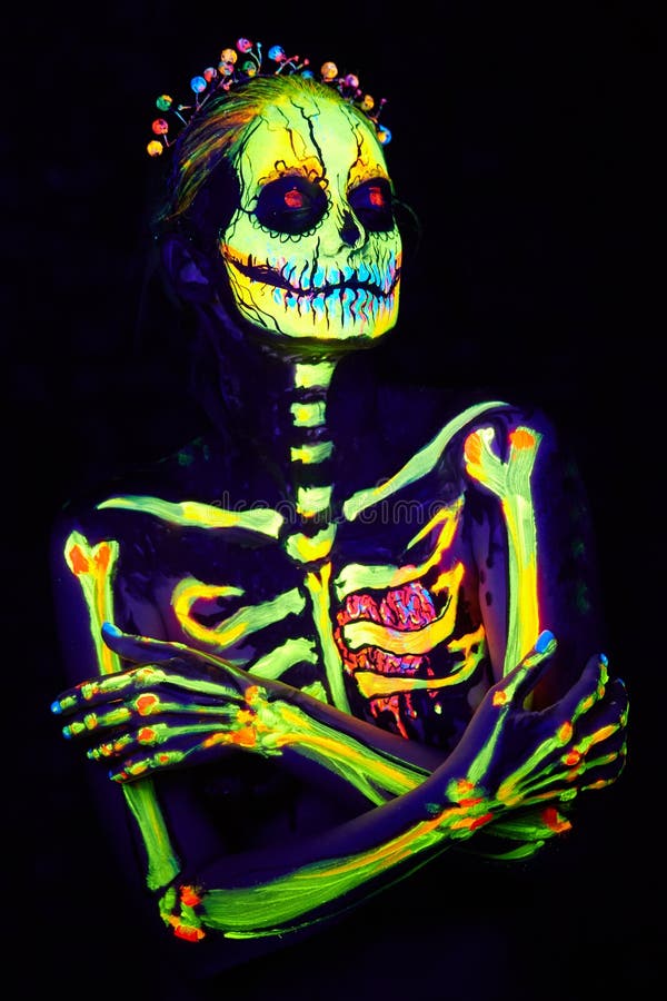 UV body art painting of helloween female skeleton