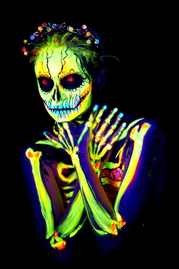 UV body art painting of helloween female skeleton